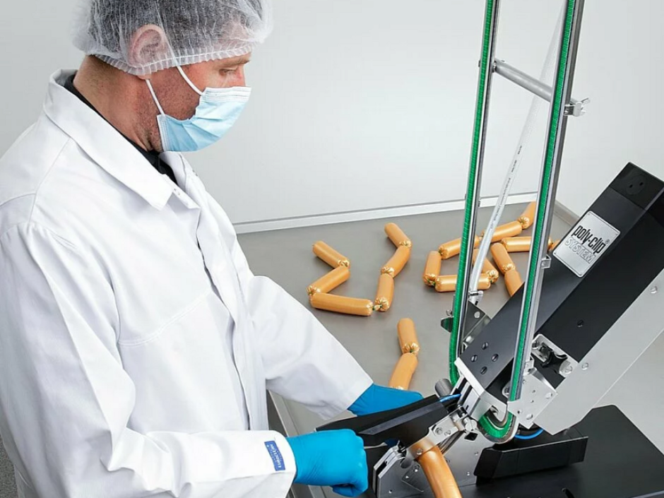 Butcher with PolyClip Sausage Clipping Machine